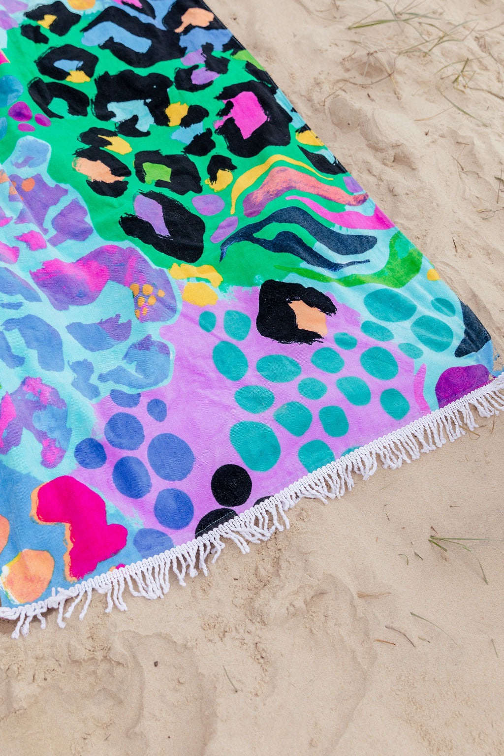 Beach Towel in Electric Leopard by Kasey Rainbow