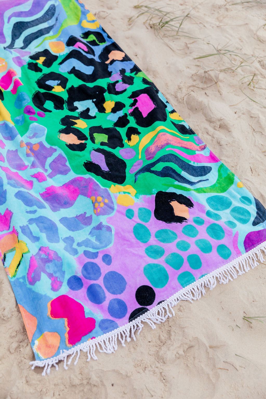 Beach Towel in Electric Leopard by Kasey Rainbow