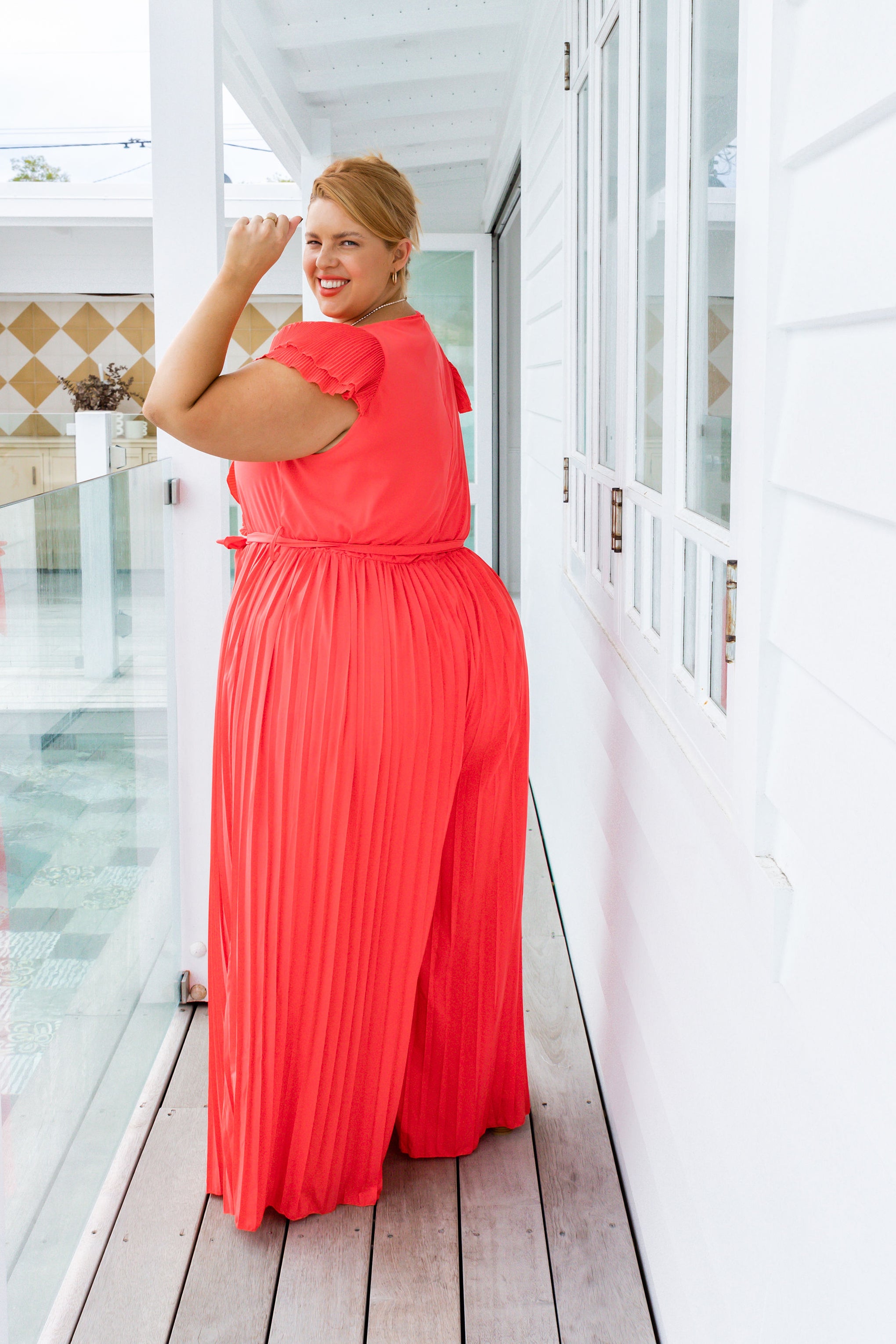 Lily Pleated Jumpsuit in Coral Red