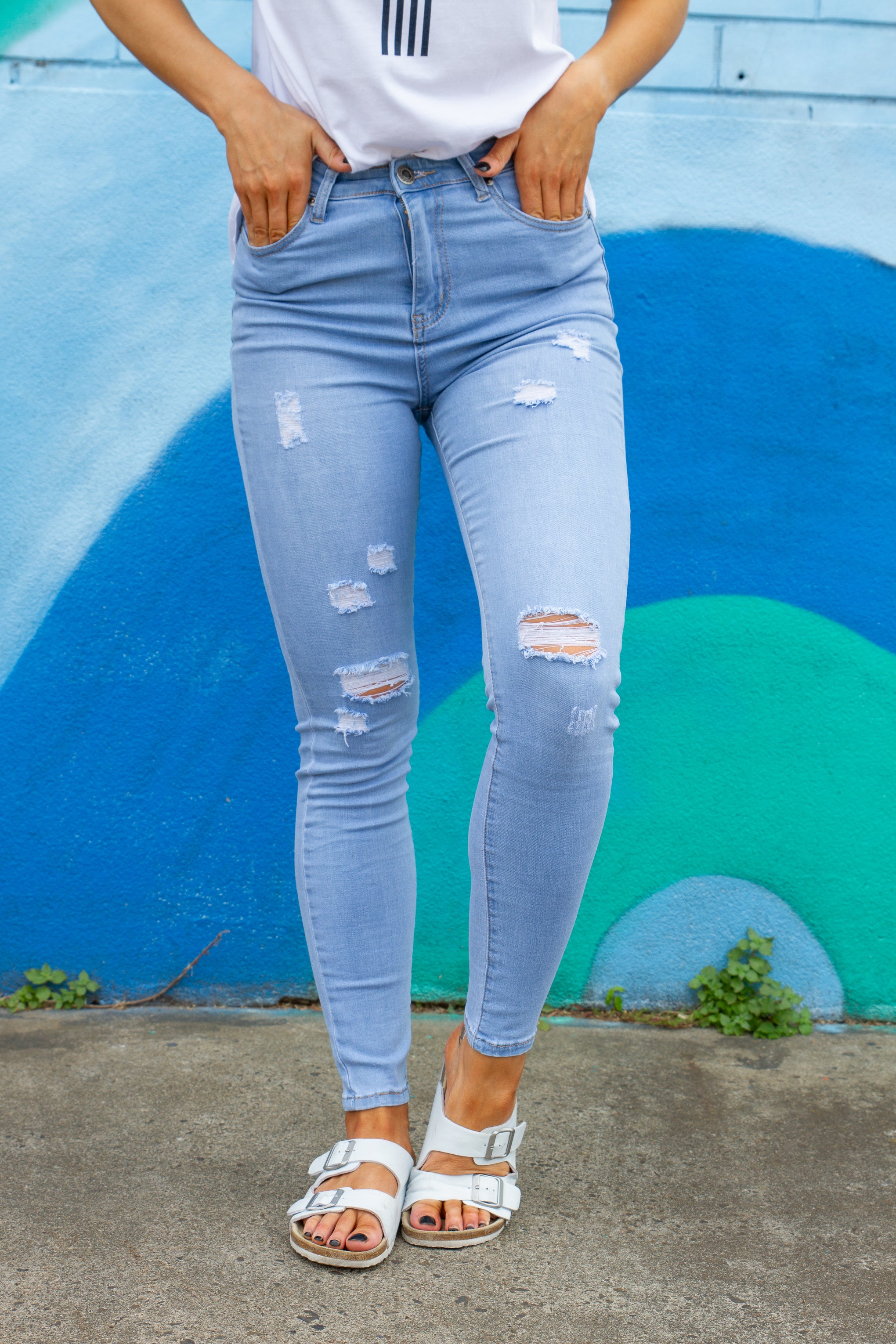 A little bit of edge to complete your denim selection. Our River Jeans are stretchy comfy & a great blue denim.   Details:  Distressed denim Skinny leg fit Functional pockets Light blue denim Sizing:  Elle wears a size 8 - true to size Fabric:  Cotton/Polyester/Elastane blend Measurements:   Size 16 Waist: 40cm Waist to ankle: 94cm Ankle: 16cm