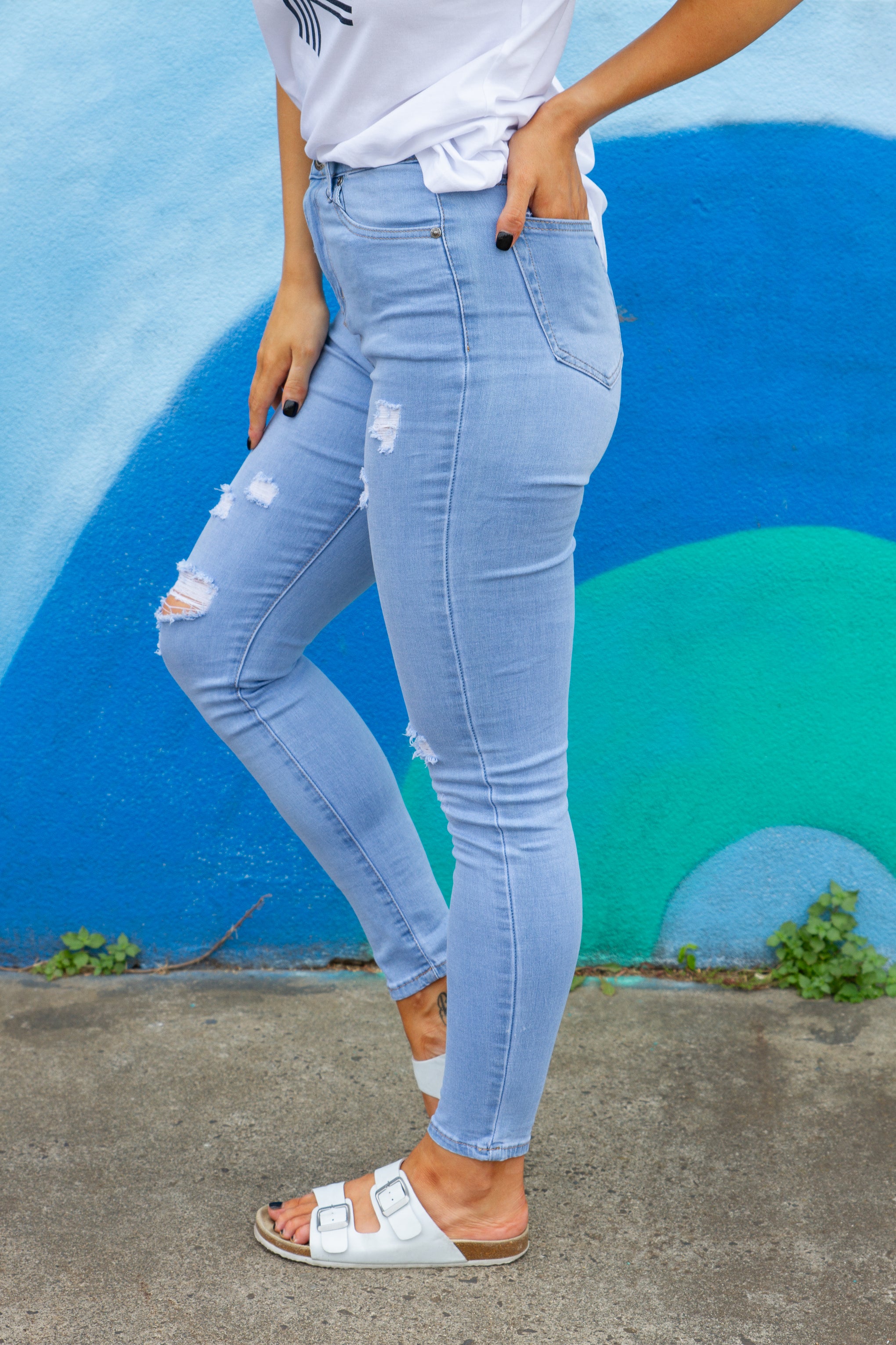 A little bit of edge to complete your denim selection. Our River Jeans are stretchy comfy & a great blue denim.   Details:  Distressed denim Skinny leg fit Functional pockets Light blue denim Sizing:  Elle wears a size 8 - true to size Fabric:  Cotton/Polyester/Elastane blend Measurements:   Size 16 Waist: 40cm Waist to ankle: 94cm Ankle: 16cm